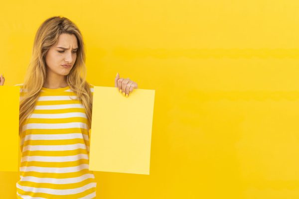 undecided-woman-holding-papers