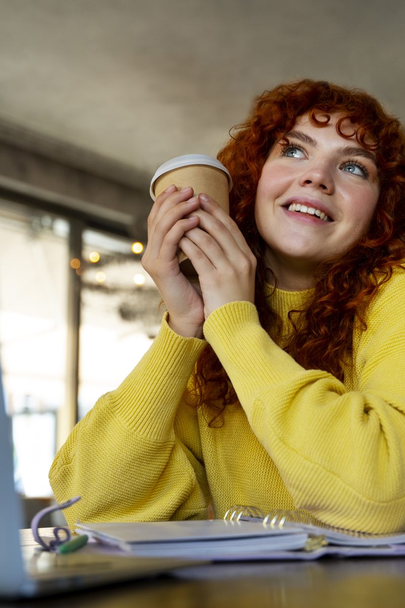 woman-drinking-hot-chocolate-cafe