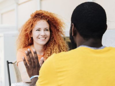 woman-smiling-holding-hands-with-her-lover